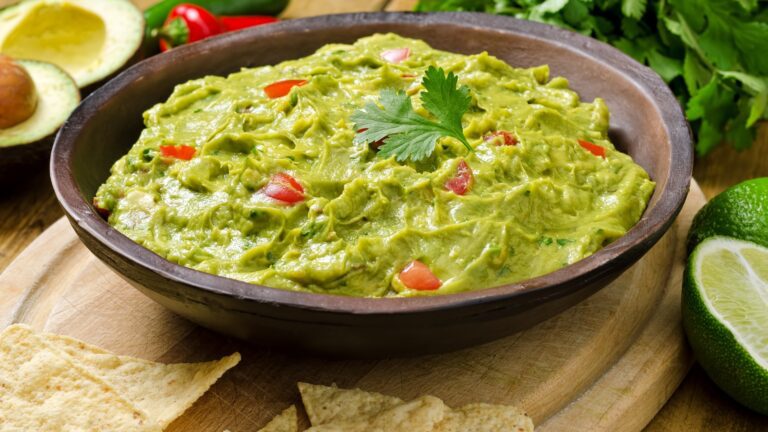 A one-cup serving of guacamole contains 366 calories, with more than half of those calories coming from fat.